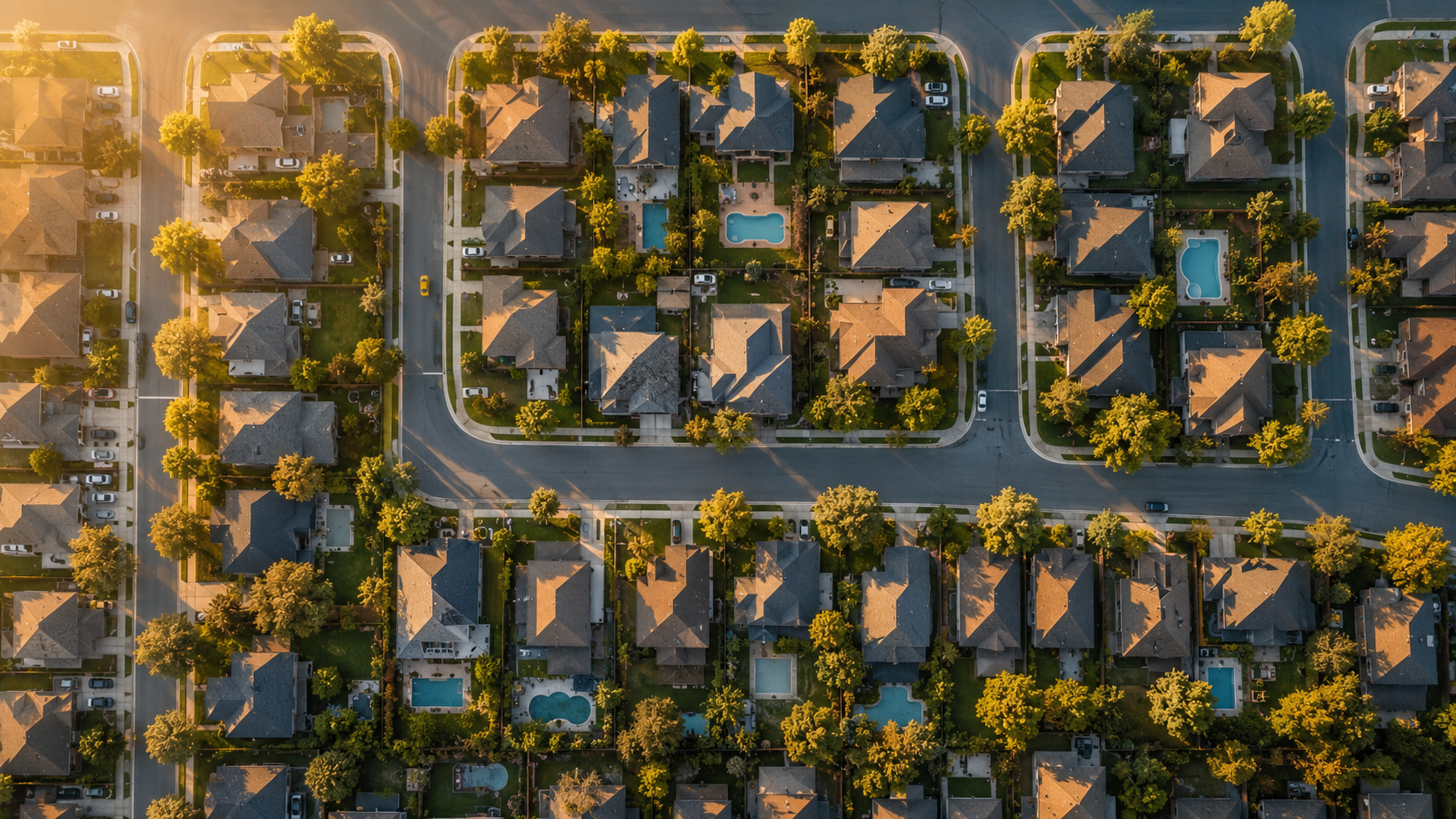 A suburban neighbourhood at sunrise, seen from above