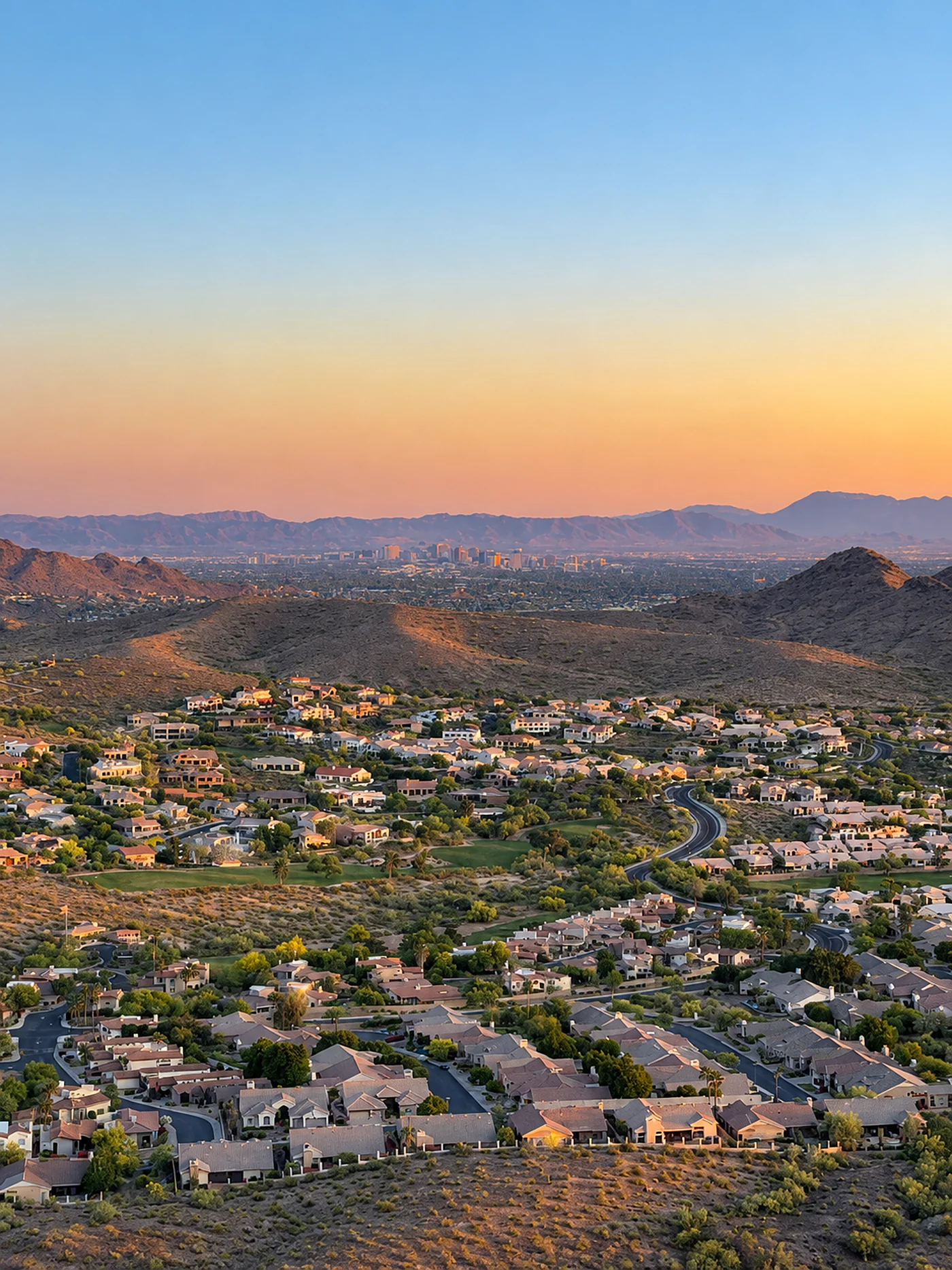 Aerial view of a residential valley at sunset